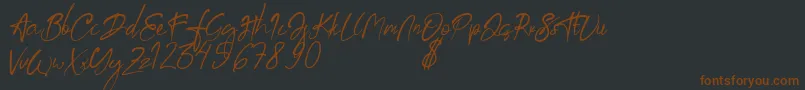 aksoro Demo Font – Brown Fonts on Black Background