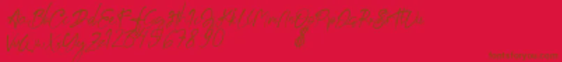 aksoro Demo-Schriftart – Braune Schriften auf rotem Hintergrund