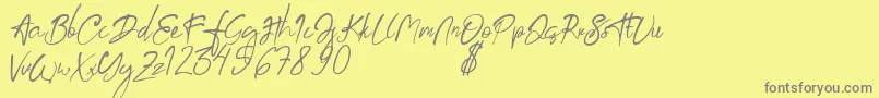 aksoro Demo-Schriftart – Graue Schriften auf gelbem Hintergrund