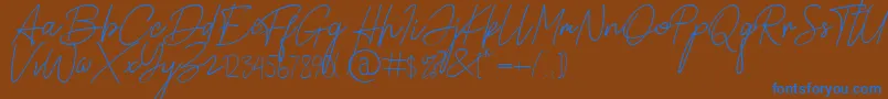 Alamanda Santika Signature-Schriftart – Blaue Schriften auf braunem Hintergrund