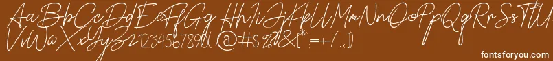 フォントAlamanda Santika Signature – 茶色の背景に白い文字