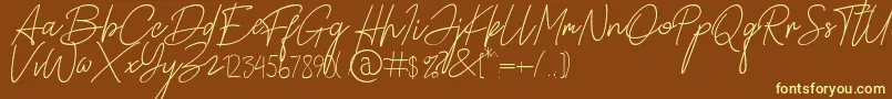 Alamanda Santika Signature-Schriftart – Gelbe Schriften auf braunem Hintergrund