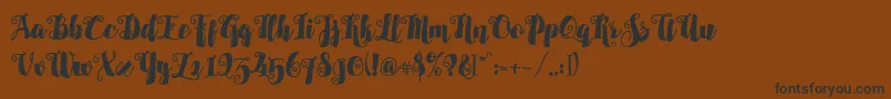 Alamark Lite Free Font – Black Fonts on Brown Background