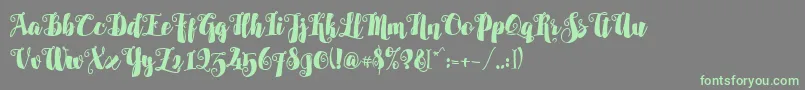 Alamark Lite Free Font – Green Fonts on Gray Background