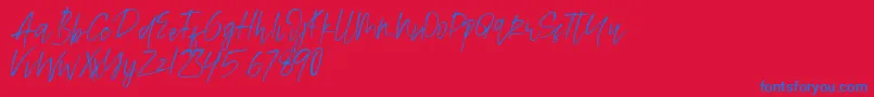 Alamode Font – Blue Fonts on Red Background