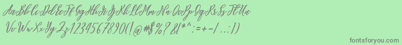 フォントalana you – 緑の背景に灰色の文字