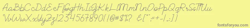 ALBELIA-fontti – harmaat kirjasimet keltaisella taustalla