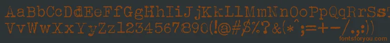 Czcionka Albertsthal Typewriter – brązowe czcionki na czarnym tle