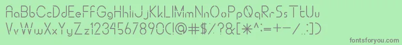 フォントALDORACutting – 緑の背景に灰色の文字