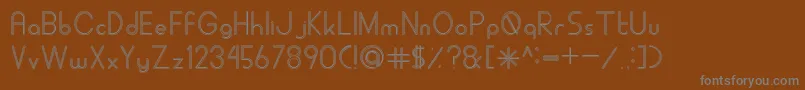 Czcionka ALDORAStroke – szare czcionki na brązowym tle