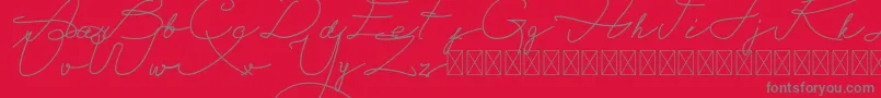 Fonte Alegant Script Free – fontes cinzas em um fundo vermelho