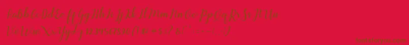 Aleria Script-Schriftart – Braune Schriften auf rotem Hintergrund