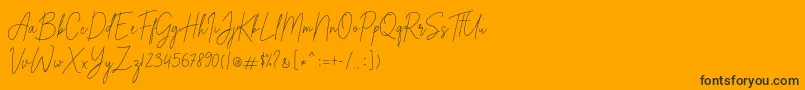 Czcionka Alexander Lettering – czarne czcionki na pomarańczowym tle