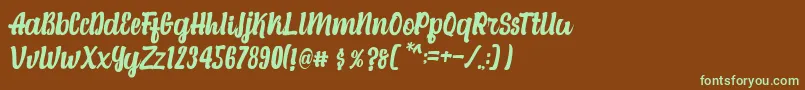 フォントAlexandria Script – 緑色の文字が茶色の背景にあります。