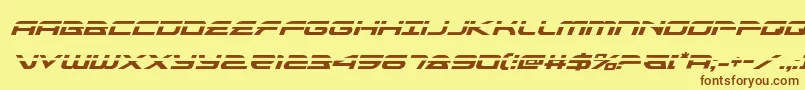 フォントalexisv3laserital – 茶色の文字が黄色の背景にあります。