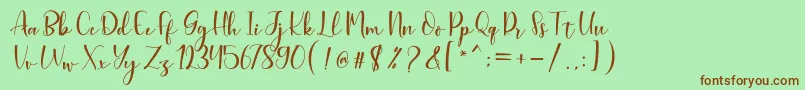 Fonte Aleysia Script – fontes marrons em um fundo verde