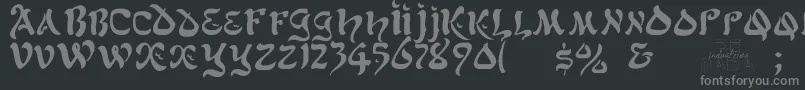 フォントAlfredDrake – 黒い背景に灰色の文字