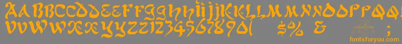 フォントAlfredDrake – オレンジの文字は灰色の背景にあります。