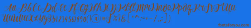 フォントAlhenya Script – 茶色の文字が青い背景にあります。