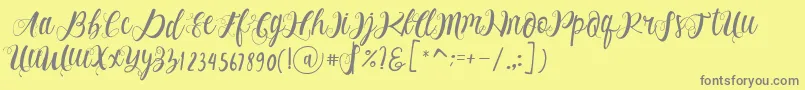 Fonte Alhenya Script – fontes cinzas em um fundo amarelo