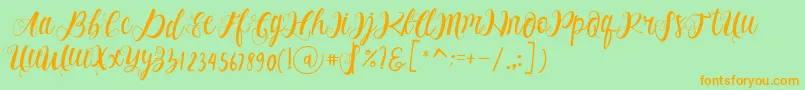 フォントAlhenya Script – オレンジの文字が緑の背景にあります。