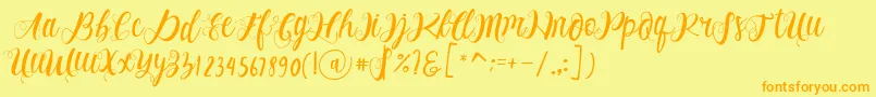 フォントAlhenya Script – オレンジの文字が黄色の背景にあります。