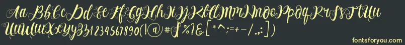 フォントAlhenya Script – 黒い背景に黄色の文字