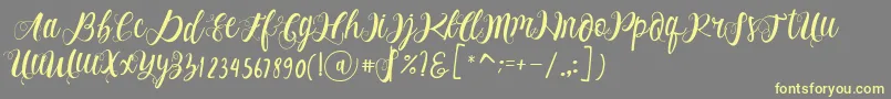 Alhenya Script-Schriftart – Gelbe Schriften auf grauem Hintergrund