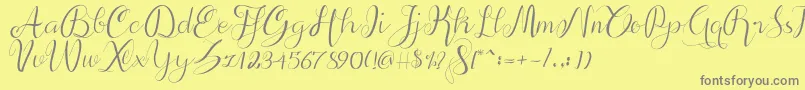 Fonte alif script – fontes cinzas em um fundo amarelo
