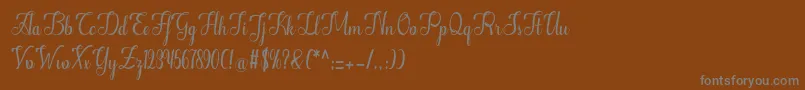 フォントAlifa – 茶色の背景に灰色の文字