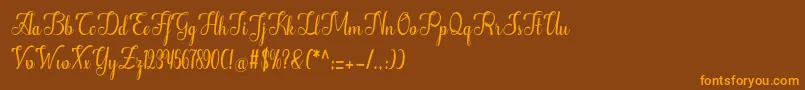 フォントAlifa – オレンジ色の文字が茶色の背景にあります。
