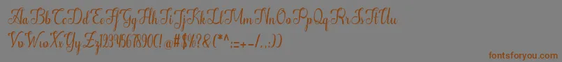 フォントAlifa – 茶色の文字が灰色の背景にあります。