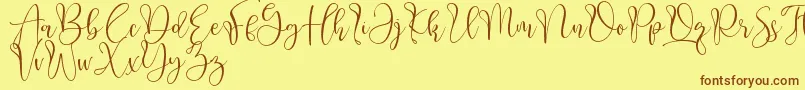 Aliquest Font – Brown Fonts on Yellow Background