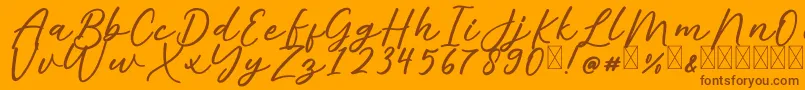 AlishaFree-Schriftart – Braune Schriften auf orangefarbenem Hintergrund