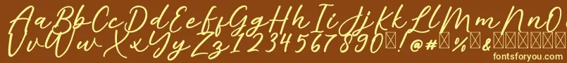 AlishaFree-Schriftart – Gelbe Schriften auf braunem Hintergrund