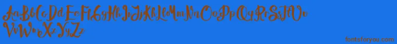 フォントAlissya – 茶色の文字が青い背景にあります。