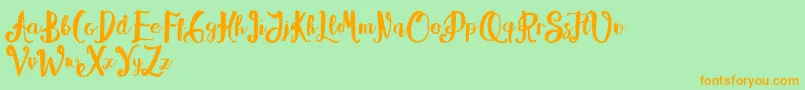 Alissya-Schriftart – Orangefarbene Schriften auf grünem Hintergrund
