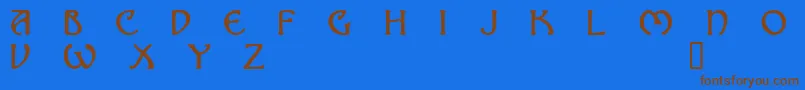 フォントNomad – 茶色の文字が青い背景にあります。