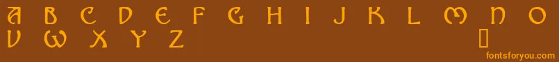 フォントNomad – オレンジ色の文字が茶色の背景にあります。