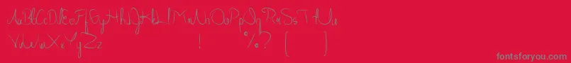 Czcionka Allabamafree – szare czcionki na czerwonym tle