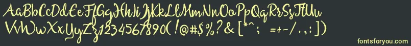 フォントAllessaScriptFreeSample – 黒い背景に黄色の文字