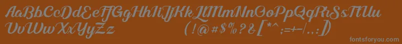 Alleyster DEMO-fontti – harmaat kirjasimet ruskealla taustalla