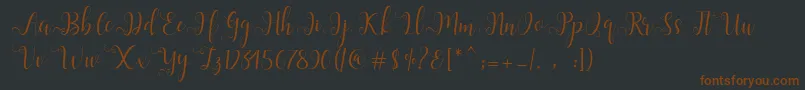 Шрифт Alliana Script  – коричневые шрифты на чёрном фоне