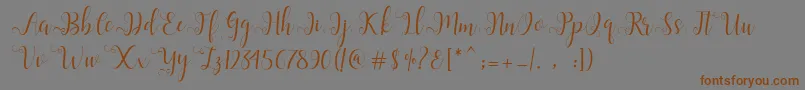 フォントAlliana Script  – 茶色の文字が灰色の背景にあります。