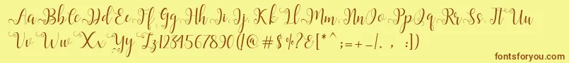 フォントAlliana Script  – 茶色の文字が黄色の背景にあります。