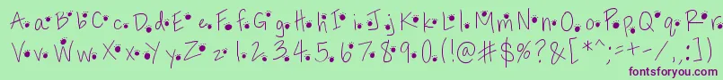 Pawprints Font – Purple Fonts on Green Background