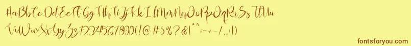 Almahira Script Font – Brown Fonts on Yellow Background