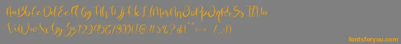 Almahira Script Font – Orange Fonts on Gray Background