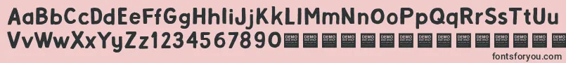 Alpha Beta   Demo-Schriftart – Schwarze Schriften auf rosa Hintergrund
