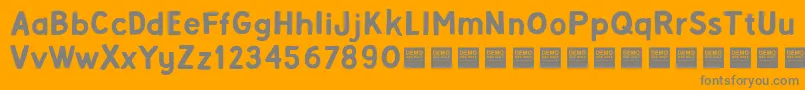 Alpha Beta   Demo-fontti – harmaat kirjasimet oranssilla taustalla